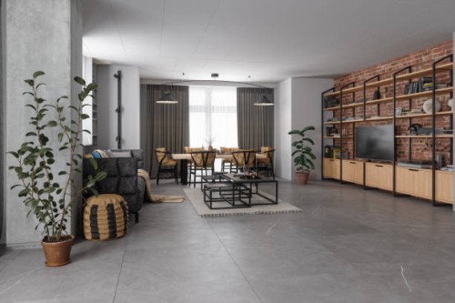 industrial style living room with sofa, dining table, chairs, television set and brick wall - home decoration stock pictures, royalty-free photos & images