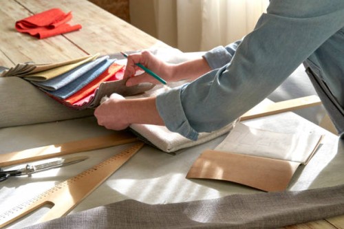 interior designer browsing fabric swatches - home decoration stock pictures, royalty-free photos & images