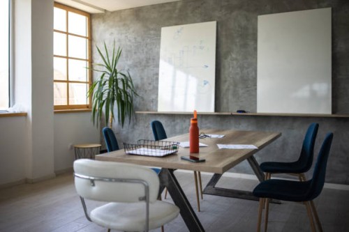 interior of modern workplace with conference table and whiteboards - home decoration stock pictures, royalty-free photos & images