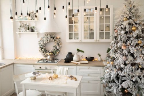 interior white kitchen with christmas decor and decorated fir tree. - home decoration stock pictures, royalty-free photos & images