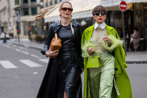 Iryna Thater wears skirt & top and coat sustainable leather from Nanushka, brown knee high boots Jimmy Choo, bag Fendi, Jacquemus sunglasses & Salome...