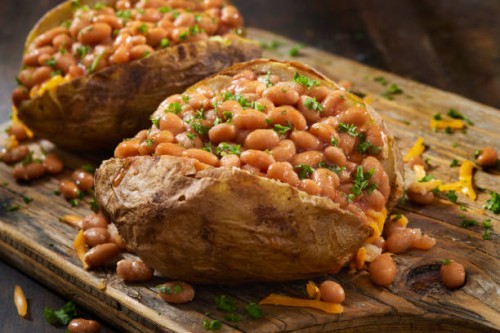 jacket potatoes with baked beans - junk food stock pictures, royalty-free photos & images