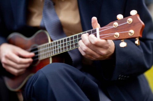 jamming on a tenor guitar - concert stock pictures, royalty-free photos & images