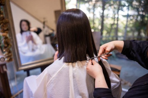 japanese woman cutting hair for hair donation - hairstyle stock pictures, royalty-free photos & images