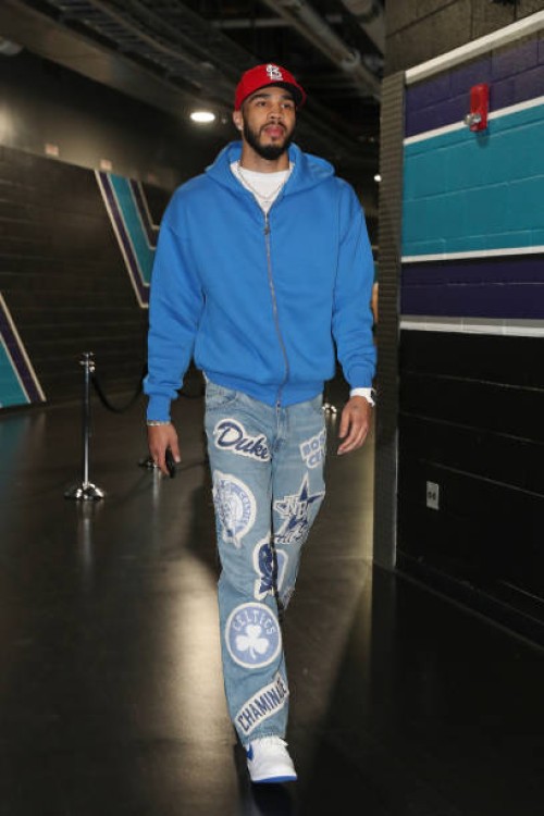 Jayson Tatum of the Boston Celtics arrives to the arena before the game against the Charlotte Hornets on April 1, 2024 at Spectrum Center in...