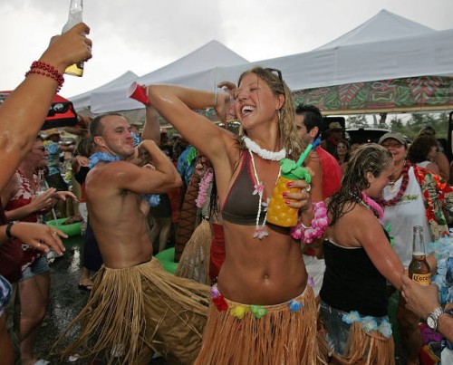 Jimmy Buffett concert at the Tweeter Center. Nikki McKinney of Weymouth dances with others out in the parking lot of the Tweeter Center.