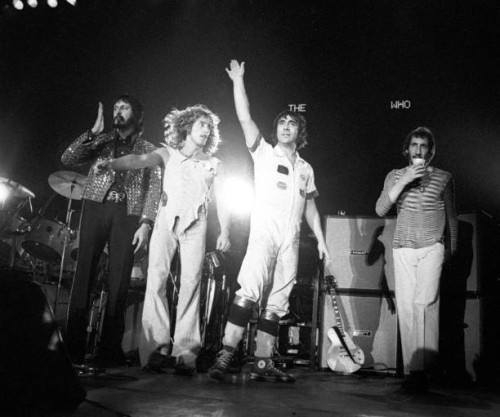 John Entwistle, Roger Daltrey, Keith Moon and Pete Townshend of The Who line up at the front of the stage at the end of a concert at Ahoy in...