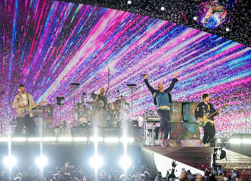 Jonny Buckland, Will Champion, Chris Martin and Guy Berryman of Coldplay perform on a stop of the band's Music of the Spheres world tour at Allegiant...