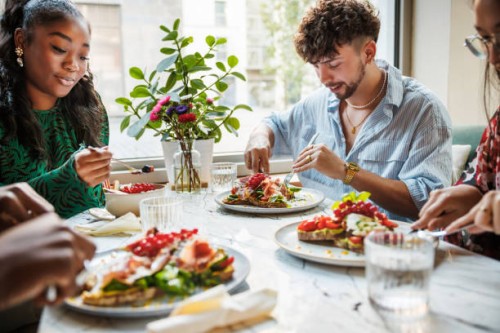 joyful brunch amongst urban friends - food stock pictures, royalty-free photos & images