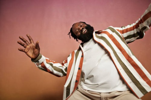 joyful man in striped shirt dancing in studio - fashion stock pictures, royalty-free photos & images
