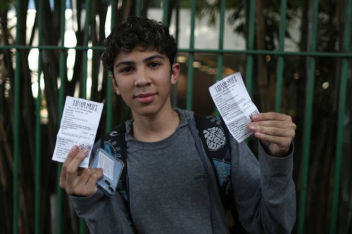 June 2023, Brazil, São Paulo: A boy shows the tikets just bought at the Allianz Parque stadium for "The Eras Tour" by Taylor Swift. After unrest...