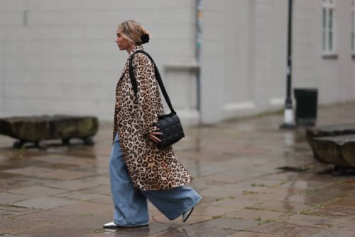 Karin Teigl seen wearing Milk White green knit cropped top with long sleeves, H&M beige / brown leopard pattern long coat, black rose hair clip, Vee...