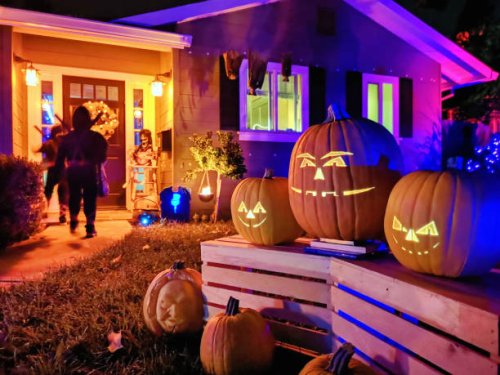 kids trick or treating on halloween night in suburban californian house - garden decoration stock pictures, royalty-free photos & images