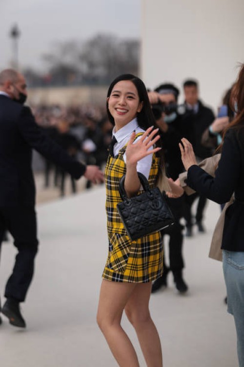 Kim Ji-soo aka Jisoo from Blackpink wears a white shirt from Dior, a black tie from Dior, a gray blazer jacket from Dior ,a white / yellow / black...