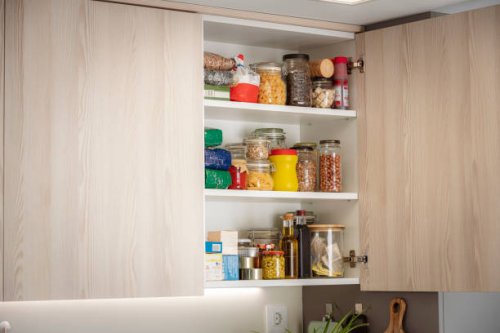 kitchen cabinet full of groceries. copy space - food stock pictures, royalty-free photos & images