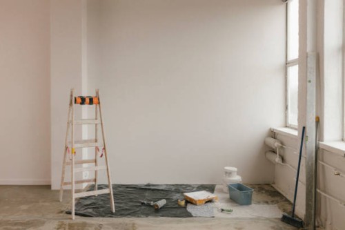 ladder by paint equipment near white wall at home - home decoration stock pictures, royalty-free photos & images