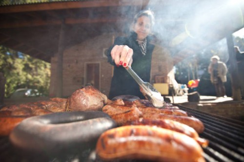 lady cooking at barbecue - food stock pictures, royalty-free photos & images