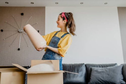 lady shopaholic customer unpacking delivery box, take out pink vase, online shopping shipment - home decoration stock pictures, royalty-free photos & images