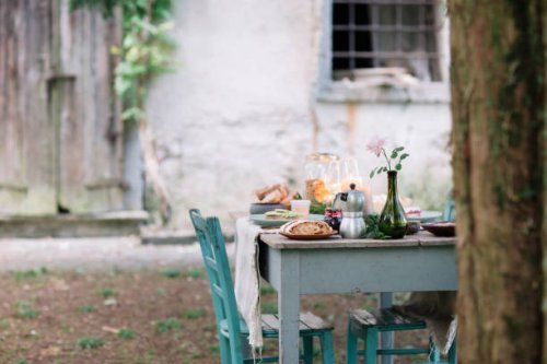 laid garden table with candles next to a cottage - garden decoration stock pictures, royalty-free photos & images