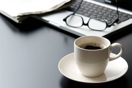 laptop and a cup of coffee on office desk - coffee stock pictures, royalty-free photos & images