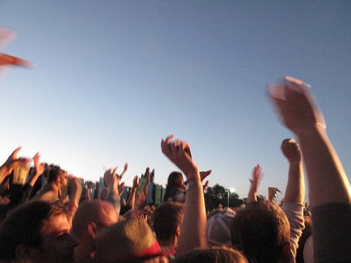 large crowd with arms in air at music festival - concert stock pictures, royalty-free photos & images