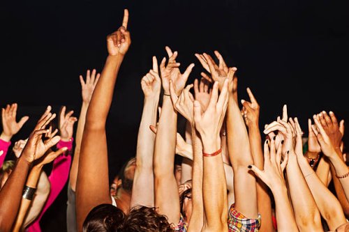 large crowd with hands up - concert stock pictures, royalty-free photos & images