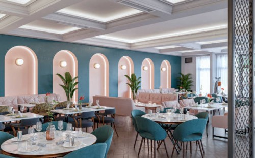 large mid century styled restaurant / bar with tables and chairs, stools, benches, ceiling moldings and windows with white curtains in the background, on parquet floor - home decoration stock pictures, royalty-free photos & i