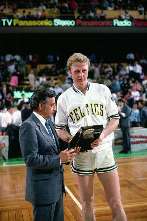 Larry Bird of the Boston Celtics receives an award after a game circa 1985 at the Boston Garden in Boston, Massachusetts. NOTE TO USER: User...