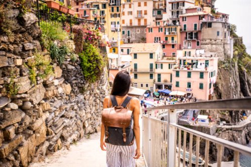 latin woman visiting beautiful town in cinque terre coast, italy - travel stock pictures, royalty-free photos & images