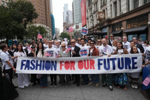 Led by US fashion designer Tory Burch and US fashion designer Michael Kors , attendees march in the "Fashion For Our Future" rally to raise awareness...