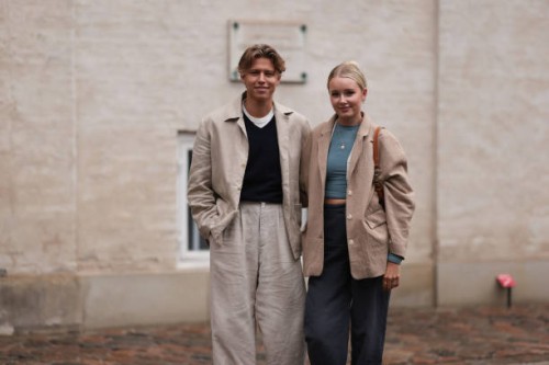 Lili Hamann seen wearing beige blazer jacket, blue crop top, beige pair of jeans, Adidas Gazelle sneakers and brown vintage Dior Saddle Bag and Levin...