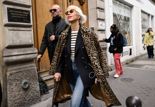 Linda Fargo is seen wearing an animal print coat, black blazer, striped shirt and blue jeans outside the Sacai show during Womenswear Spring/Summer...