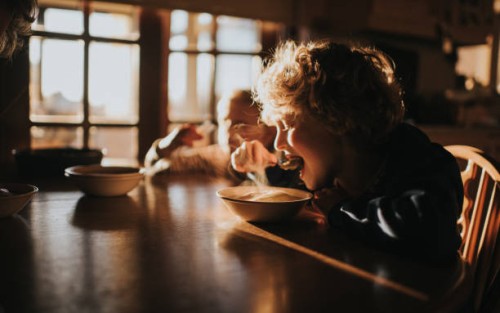 little boy eating pudding - food stock pictures, royalty-free photos & images