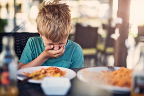 little boy going to be sick in restaurant - food stock pictures, royalty-free photos & images
