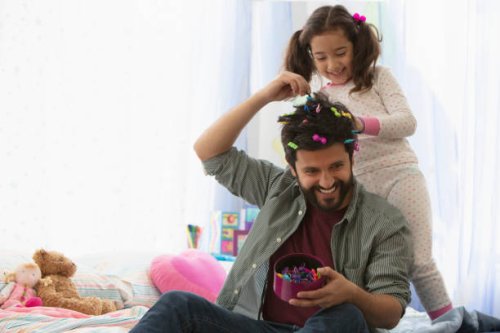 little girl doing father's hair - hairstyle stock pictures, royalty-free photos & images