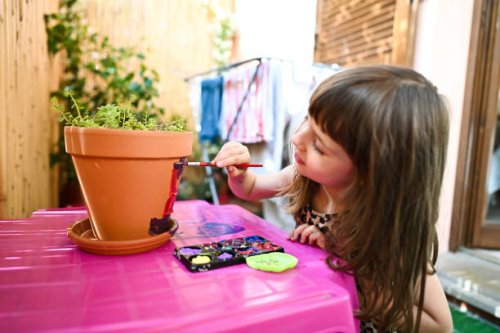 little girl playing with paints - garden decoration stock pictures, royalty-free photos & images