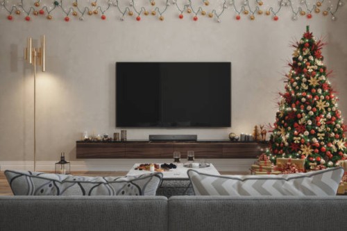 living room interior with christmas tree, ornaments, gift boxes, red sofa and lcd tv set - home decoration stock pictures, royalty-free photos & images