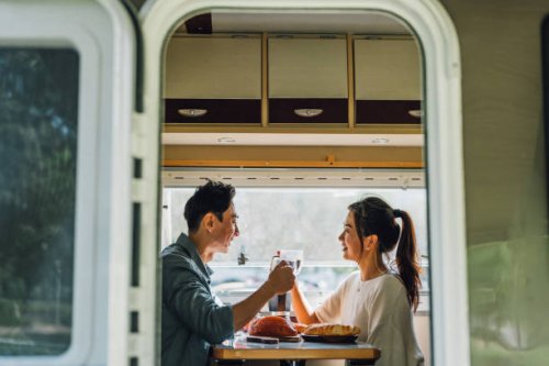 lovely asian chinese couple enjoy breakfast with their camper van - camper van travel series - travel stock pictures, royalty-free photos & images