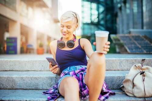 lovely girl typing message to boyfriend - junk food stock pictures, royalty-free photos & images