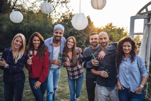 lovely group of young people enjoying a party - garden decoration stock pictures, royalty-free photos & images
