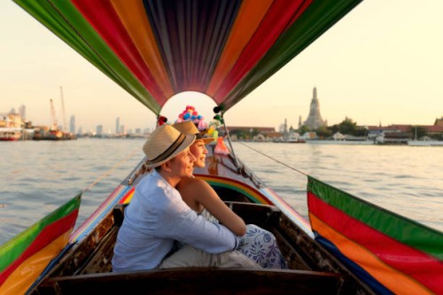 lover couple journey around city for sightseeing landmarks by long tail boat. local travel destination. - travel stock pictures, royalty-free photos & images