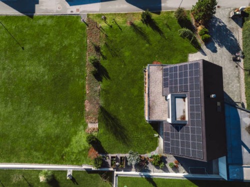 low aerial close view new dense rural housing development, mostly grey roofing, some green landscaping, young trees. modern homes with flat roof - garden decoration stock pictures, royalty-free photos & images