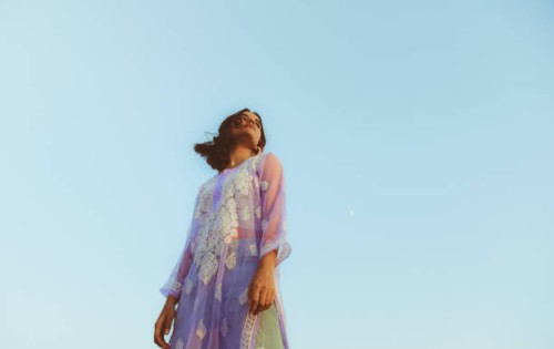 low angle view of woman standing against clear sky,india - fashion photos et images de collection