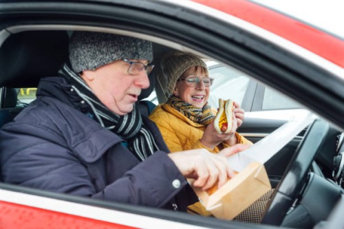 lunch in the car - junk food stock pictures, royalty-free photos & images