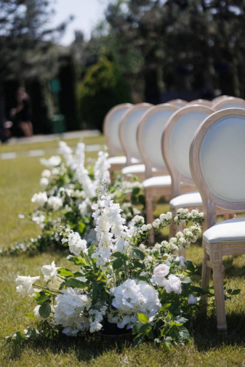 lush floral compositions at the outdoor wedding reception - garden decoration stock pictures, royalty-free photos & images