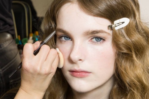 Makeup artist applies makeup to a model in backstage at the Max Mara fashion show during the Milan Fashion Week - Womenswear Fall/Winter 2025/2026 on...