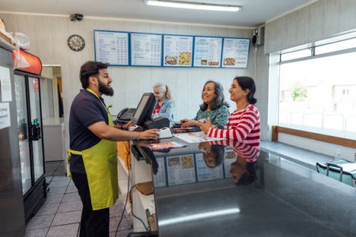 making an order at a takeaway - junk food stock pictures, royalty-free photos & images