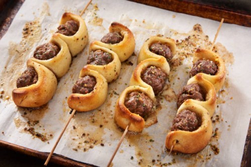 making the viral baked meatball sub on a stick - junk food stock pictures, royalty-free photos & images