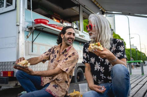 male friends eating street food - junk food stock pictures, royalty-free photos & images