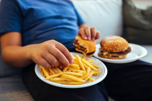 male hands eating french fries - junk food stock pictures, royalty-free photos & images